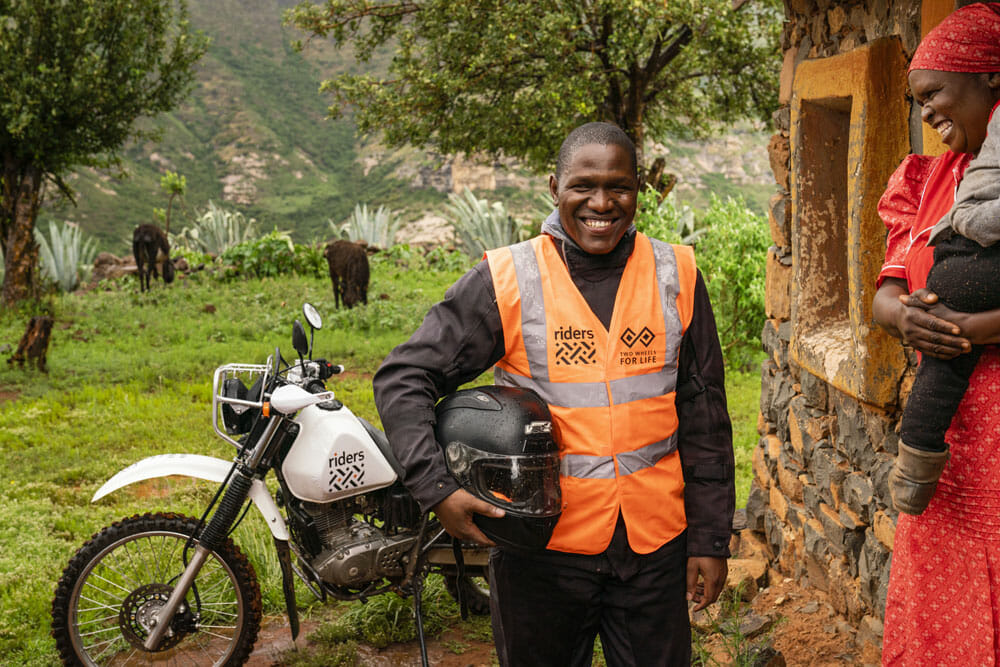 Riders for Health Lesotho, school, healthworker, child, mother, motorcycle